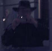 me in a hat and a mirror, blurred